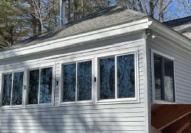 Exterior view of a home with Solar View Mylar Shades reflecting sunlight for daytime privacy while reducing heat, glare, and UV rays.