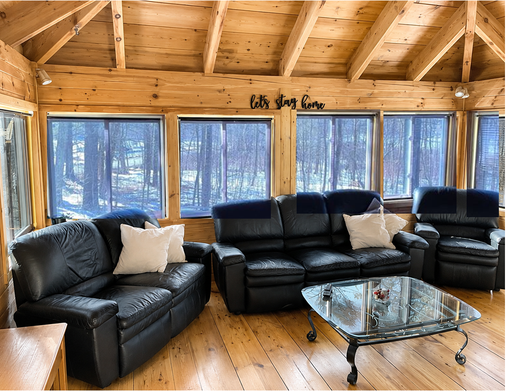 Solar View Mylar Shades on residential windows overlooking a wooded landscape